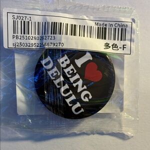 “I love being delulu” pin